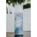 A 100ml can of Samson's Haircare Foster Curl Creme Medium/low hold hair spray, standing upright on a dark surface with a blurred white planter and green leaves in the background.