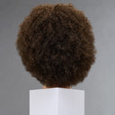A dark brown textured afro wig displayed on a white mannequin head against a neutral gray background.