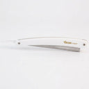 white plastic handle shaving razor with metal blade holder on a white background. Razor shown in closed position