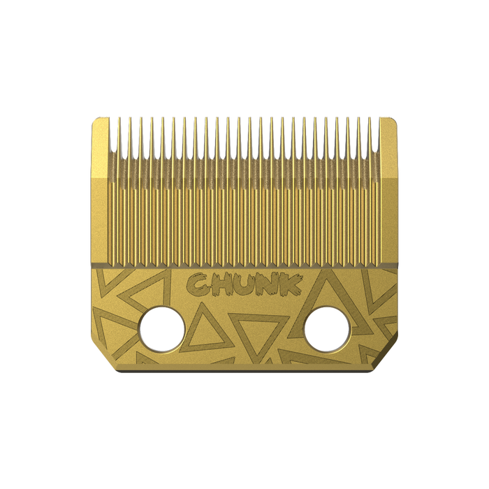 Gold hair clipper blade with geometric design on a white background