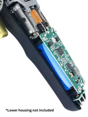 Close-up of electronic device with circuit board and mechanical components on a white background.