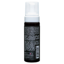 Suavecito Curl Mousse brown bottle with white pump cap on white background showing the back side of the bottle listing ingredients etc