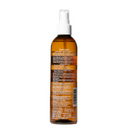 Brown spray bottle with white nozzle on a white background